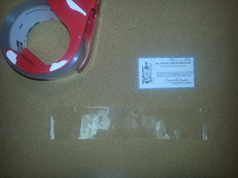 Tear off a length of clear 2" packing tape